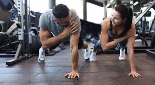 Toning Bingo Wings: Your Ultimate Guide to Sculpting Sleek Arms at the Gym 3 Fitness trainer demonstrating arm toning exercises Addlestone