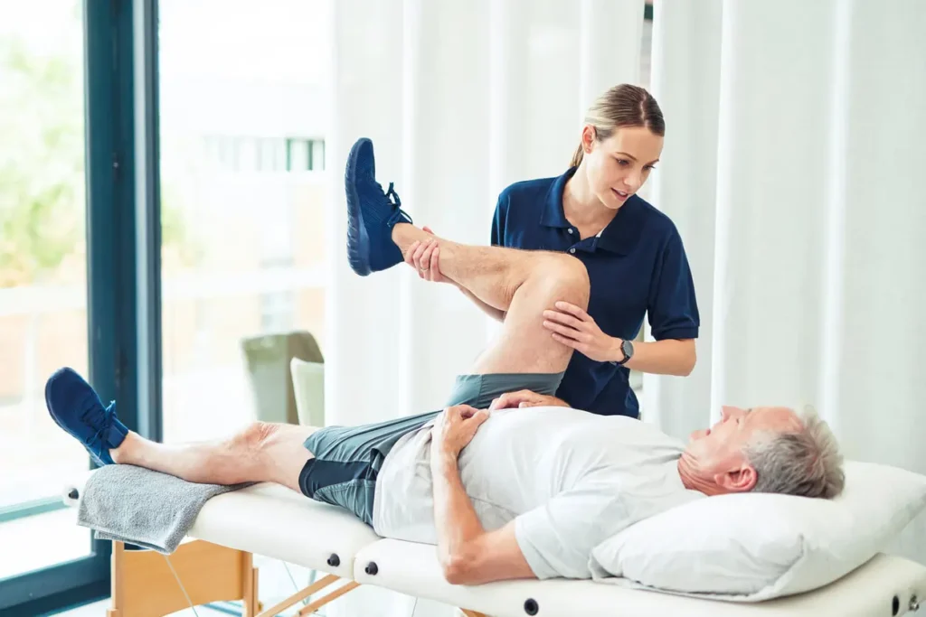 Revitalising Recovery: Effective Rehabilitation Strategies for Muscle Injuries 3 Physiotherapist assisting a patient with muscle recovery exercises Addlestone